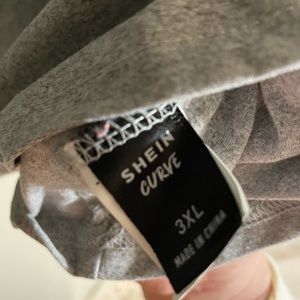 SHEIN CURVE t-shirt with polka dot accents.